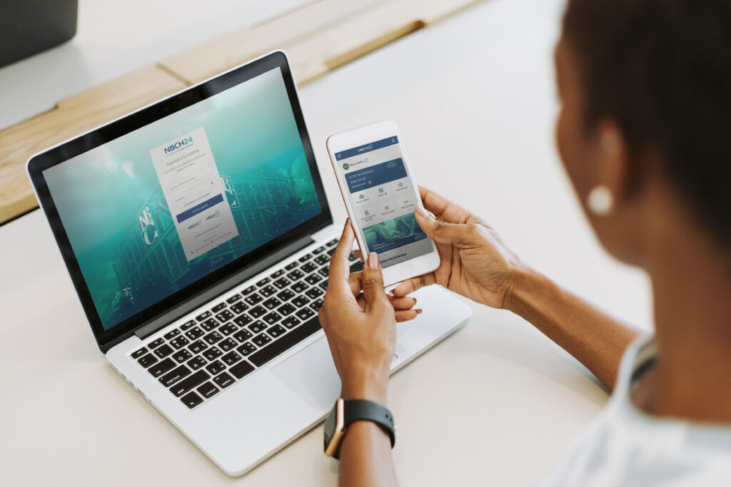 Woman using laptop and smartphone